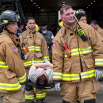 Casualty transported by Fire Department on a patient litter during an Active Shooter Misawa Base Exercise.